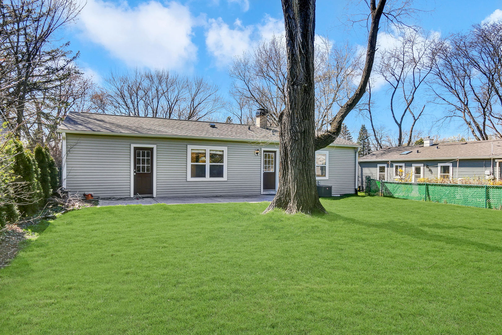 273 Raupp Boulevard Buffalo Grove, IL 60089 - Photo 17 of 18 a house view with a garden space
