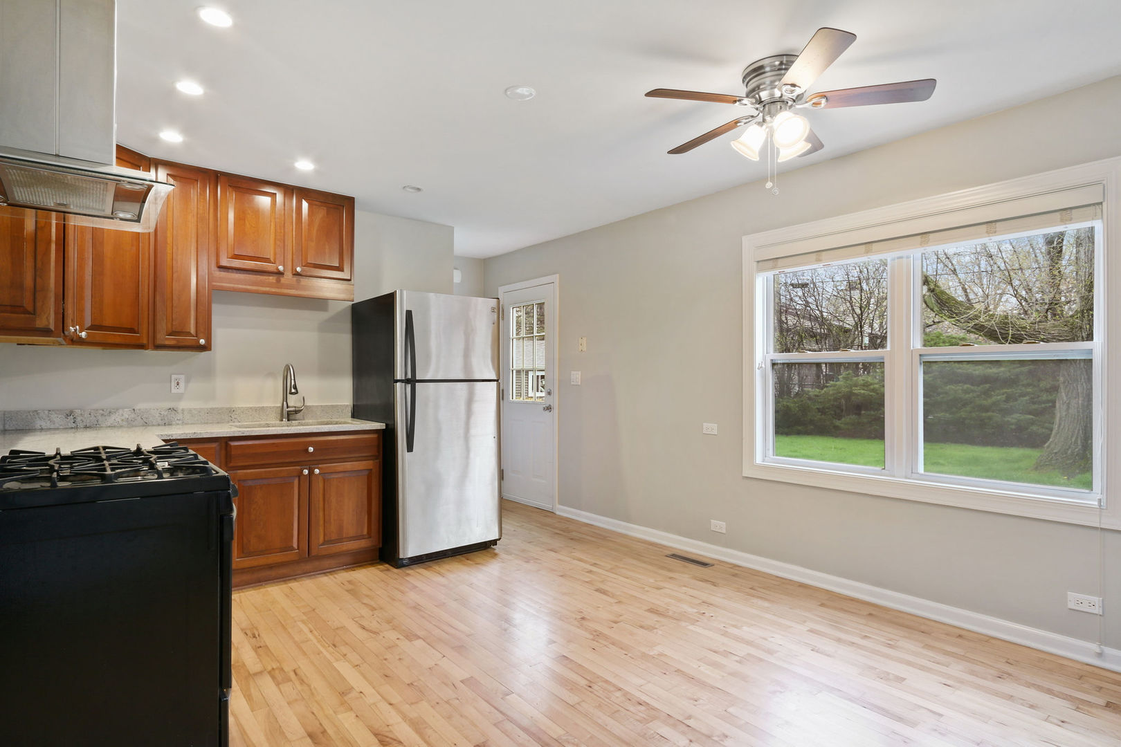 273 Raupp Boulevard Buffalo Grove, IL 60089 - Photo 6 of 18 a kitchen with stainless steel appliances granite countertop a refrigerator a stove a sink dishwasher and a refrigerator