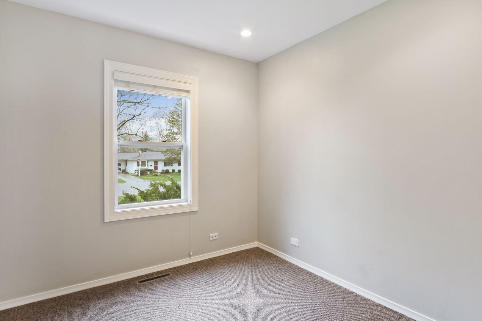 273 Raupp Boulevard Buffalo Grove, IL 60089 - Photo 8 of 18 an empty room with windows