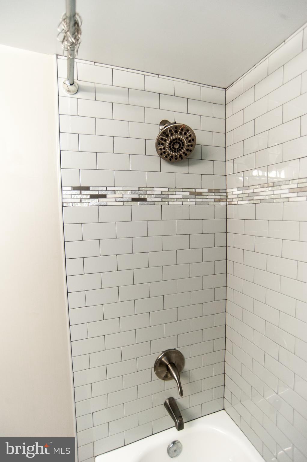 2022 4th Street Northeast, Unit B Washington, DC 20002 - Photo 13 of 16 a bathroom with a shower