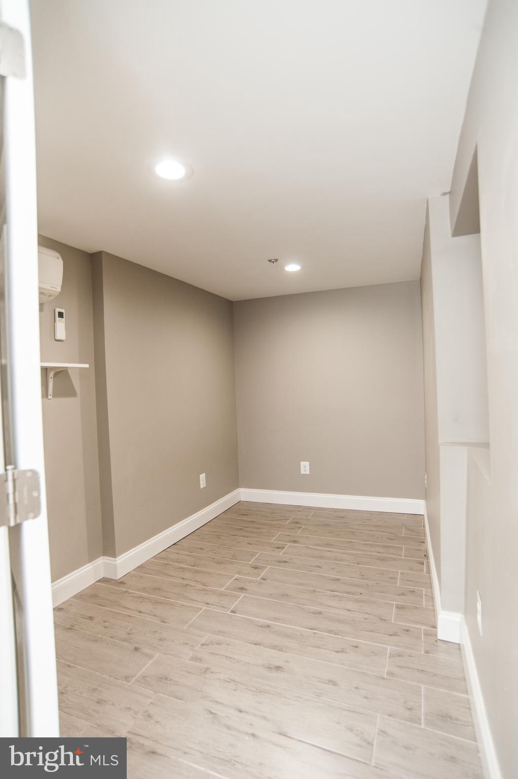 2022 4th Street Northeast, Unit B Washington, DC 20002 - Photo 14 of 16 a view of an empty room with wooden floor