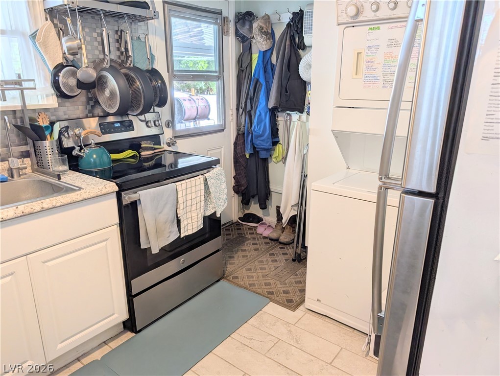 102 Rowan Drive Caliente, NV 89008 - Photo 10 of 28 Functional kitchen with ample counter space and convenient laundry facilities.