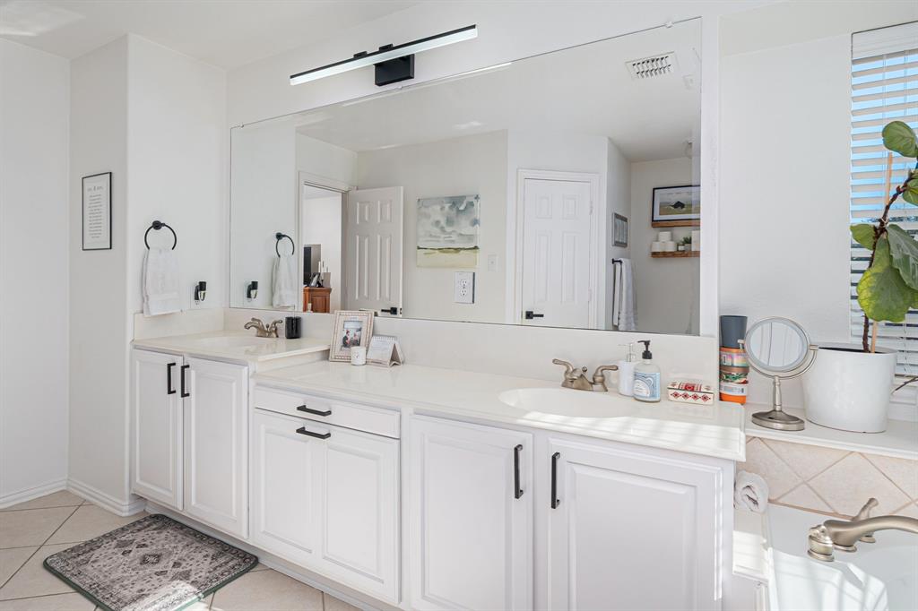 14521 Crystal Lake Drive Little Elm, TX 75068 - Photo 23 of 40 a bathroom with a sink vanity granite and a mirror