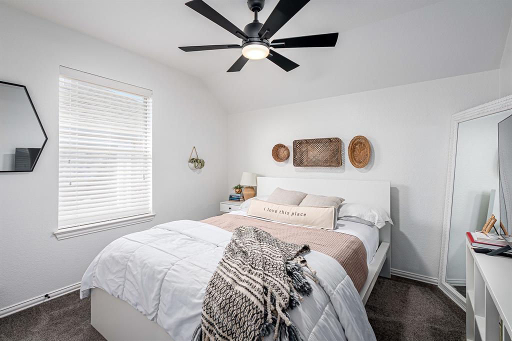 14521 Crystal Lake Drive Little Elm, TX 75068 - Photo 25 of 40 a bedroom with a bed and a large window