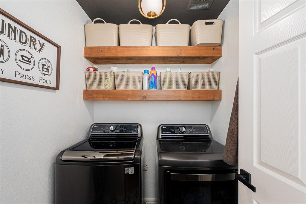 14521 Crystal Lake Drive Little Elm, TX 75068 - Photo 28 of 40 a kitchen with stainless steel appliances granite countertop a stove and a microwave