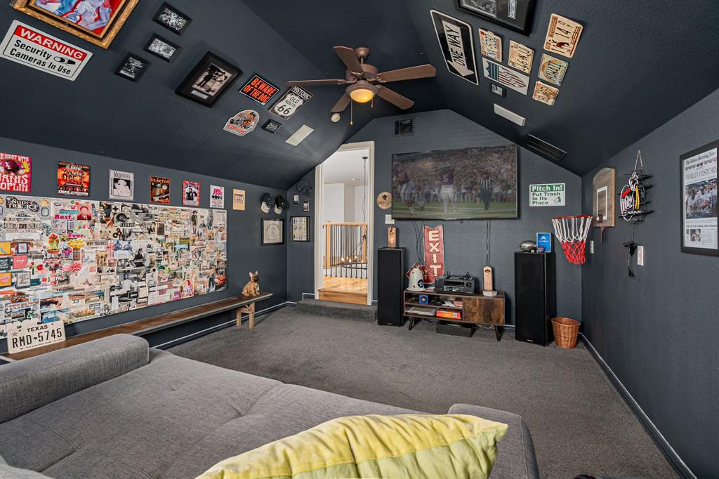 14521 Crystal Lake Drive Little Elm, TX 75068 - Photo 30 of 40 a view of gym equipment with a projector and couch