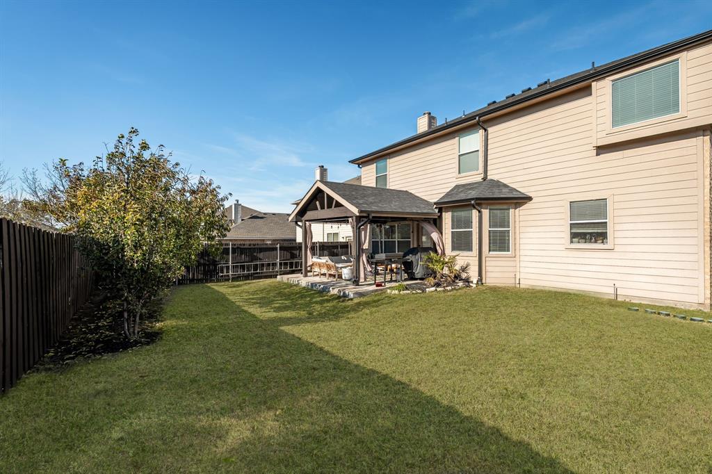 14521 Crystal Lake Drive Little Elm, TX 75068 - Photo 34 of 40 a front view of a house with swimming pool having outdoor seating