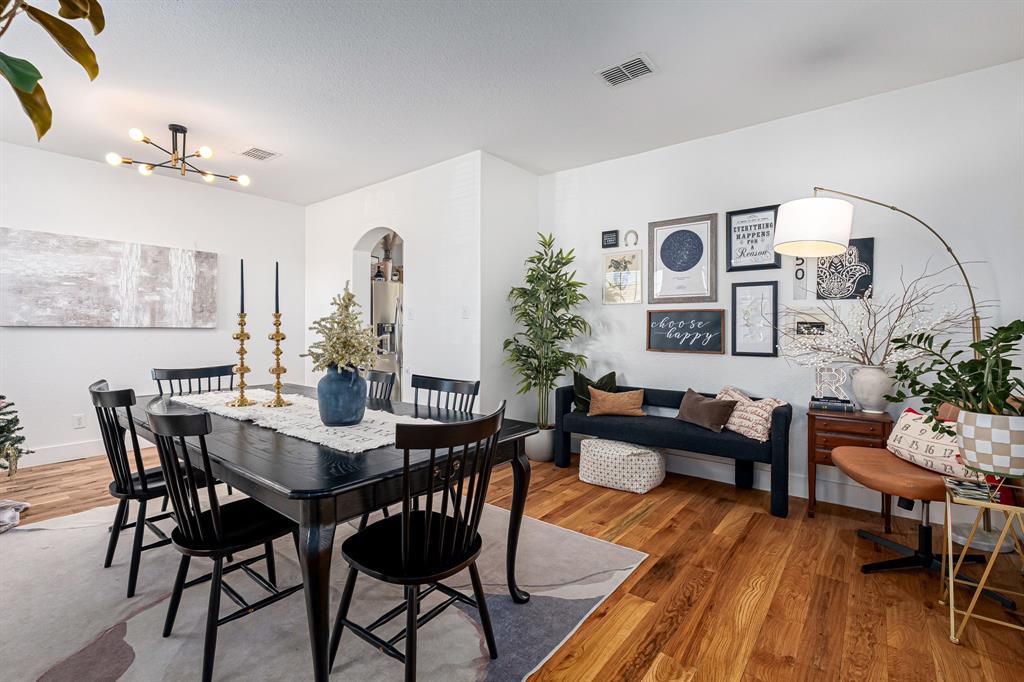 14521 Crystal Lake Drive Little Elm, TX 75068 - Photo 9 of 40 a view of a dining room with furniture and wooden floor