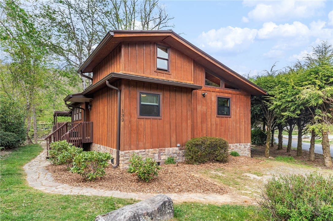 139 Golden Rod Loop Newland, NC 28657 - Photo 1 of 39 a front view of a house with garden