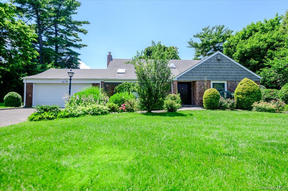70 Longfellow Road Great Neck, NY 11023 - Photo 1 of 28 a house view with a garden space