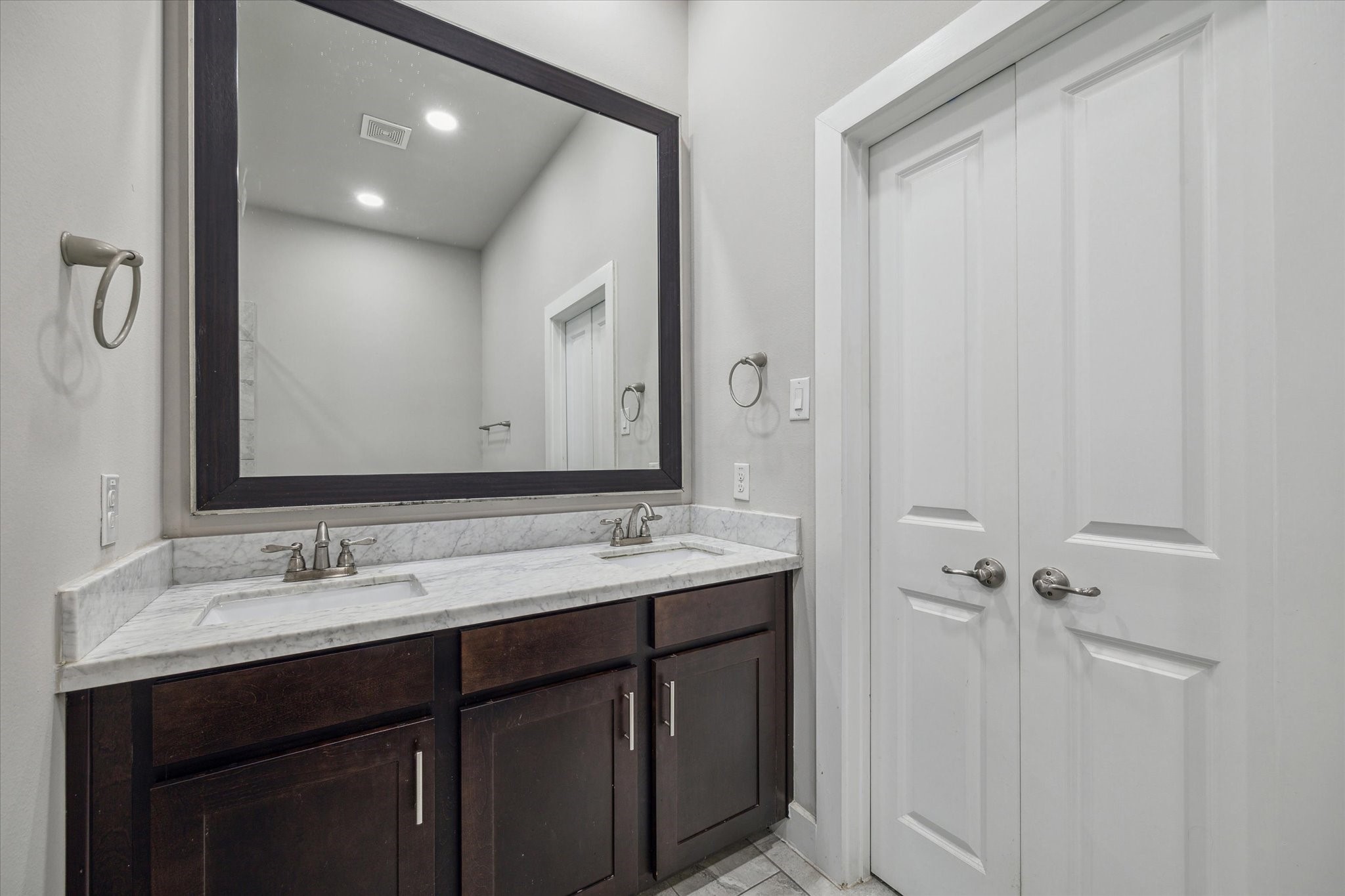 4508 Cornish Street, Unit A Houston, TX 77007 - Photo 12 of 22 Primary bath features double sinks, a soaking tub, and walk-in shower. Massive walk in closet beyond the double doors!