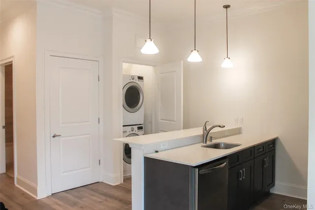 a kitchen with a sink and a refrigerator