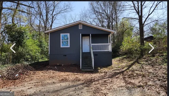 a house with trees in the background