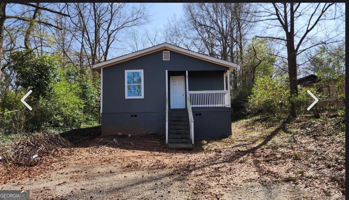 a house with trees in the background