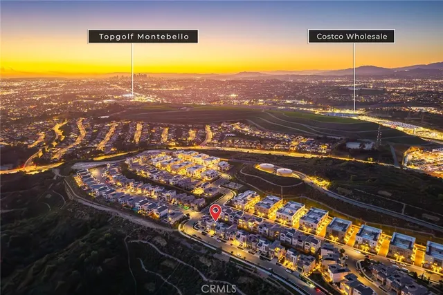 a view of a city with mountains in the background