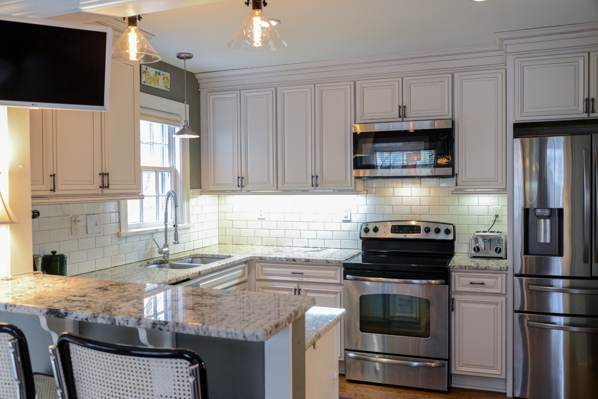 2905 Snowden Road Nashville, TN 37204 - Photo 13 of 40 a kitchen with granite countertop a sink stove and refrigerator