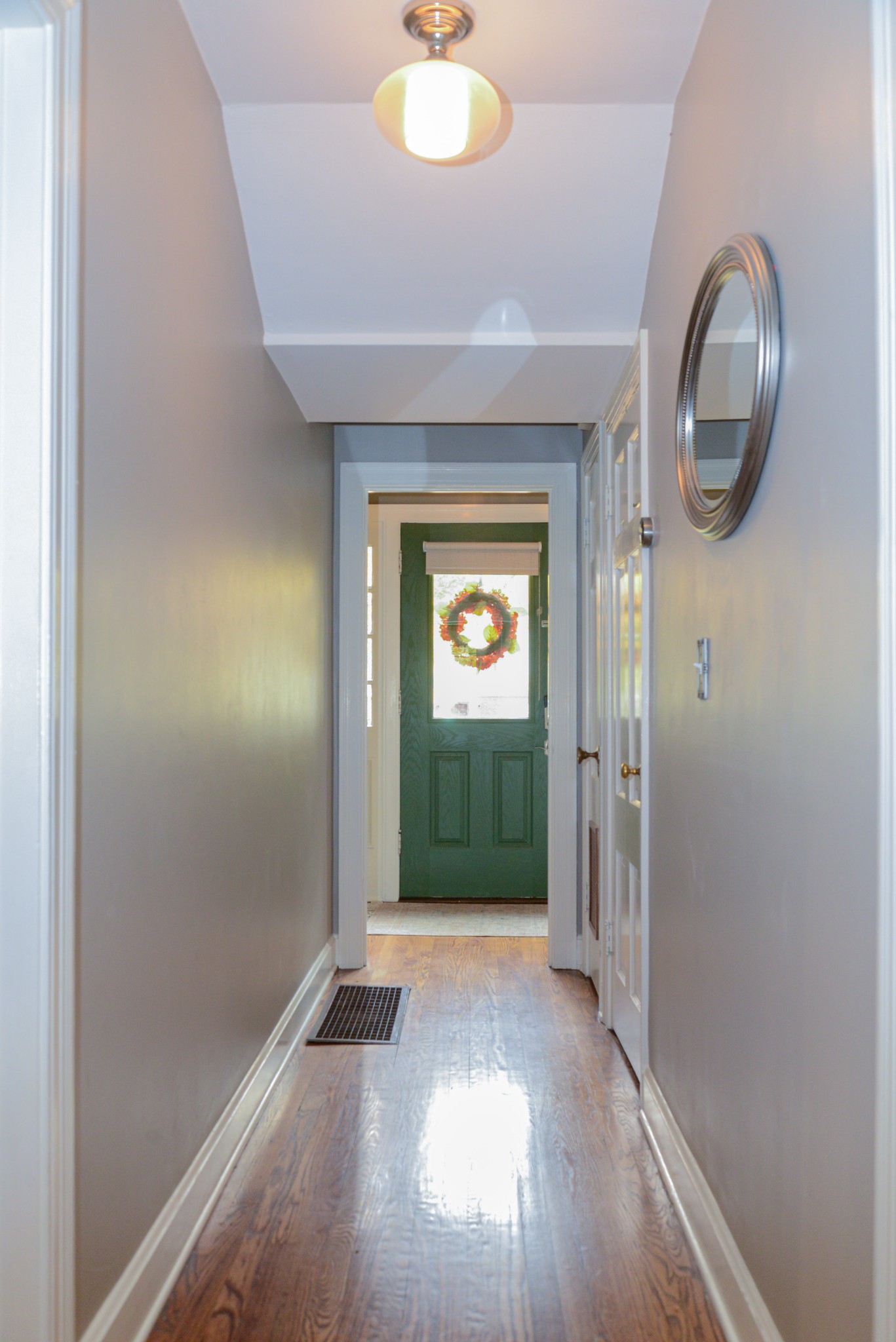 2905 Snowden Road Nashville, TN 37204 - Photo 16 of 40 a view of a hallway with wooden floor and a mirror