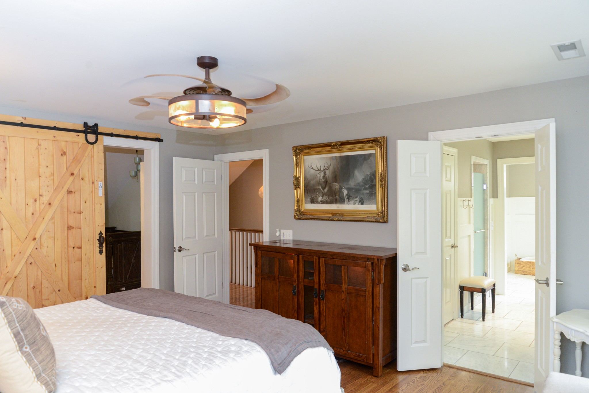 2905 Snowden Road Nashville, TN 37204 - Photo 28 of 40 a bedroom with a bed and a chandelier