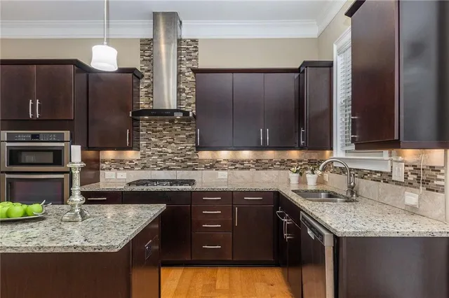 a kitchen with a sink stove and cabinets