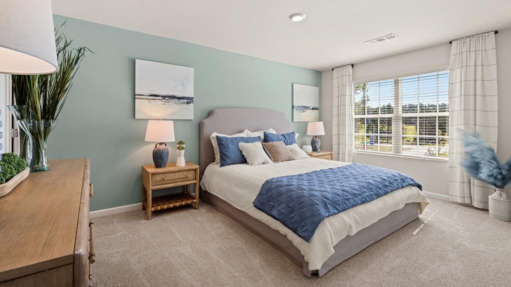 4 Sweetspire Drive Northwest Rome, GA 30165 - Photo 21 of 47 a spacious bedroom with a bed table chair and a window