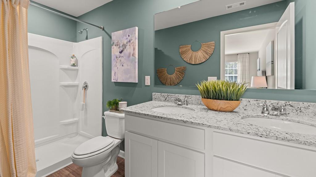 4 Sweetspire Drive Northwest Rome, GA 30165 - Photo 26 of 47 a bathroom with a granite countertop sink toilet and shower