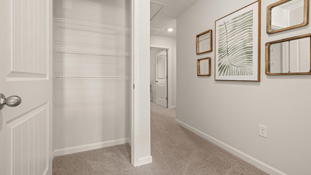 4 Sweetspire Drive Northwest Rome, GA 30165 - Photo 28 of 47 a view of a hallway with paintings on the wall