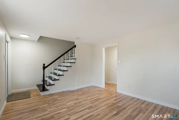 a view of entryway with wooden floor