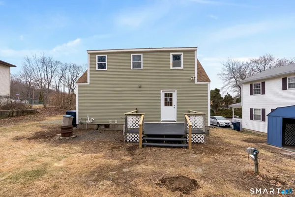 a view of backyard with seating space