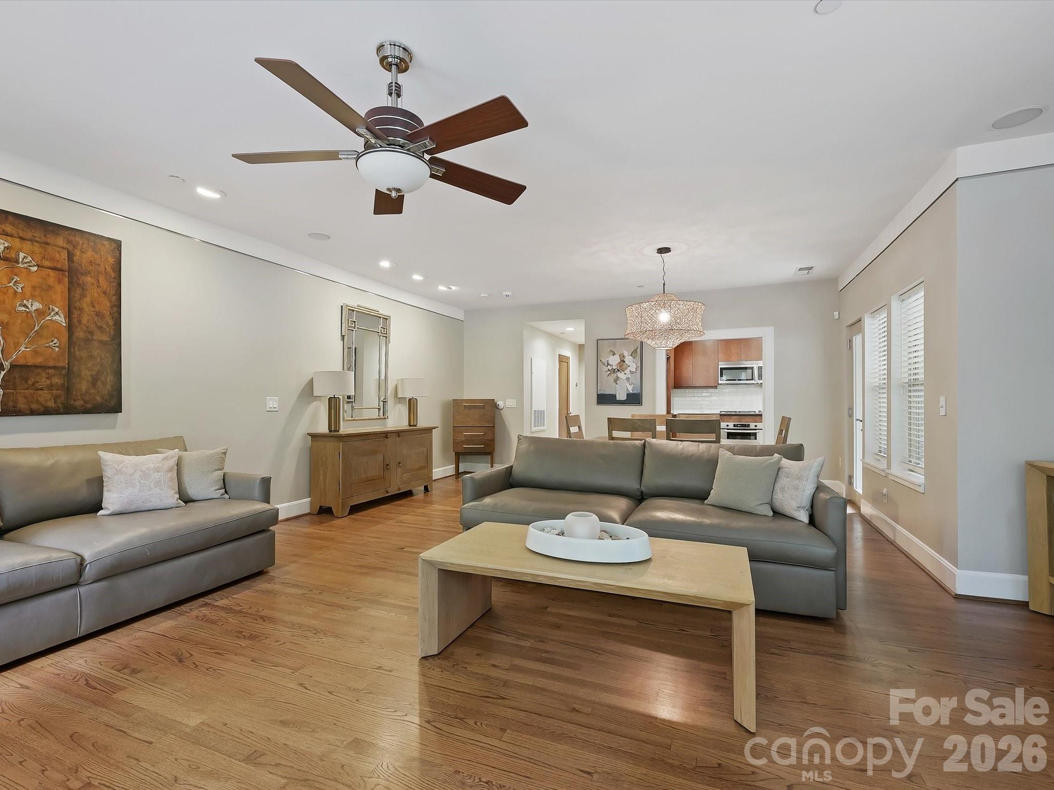 420 Queens Road Charlotte, NC 28207 - Photo 13 of 35 a living room with furniture and a ceiling fan