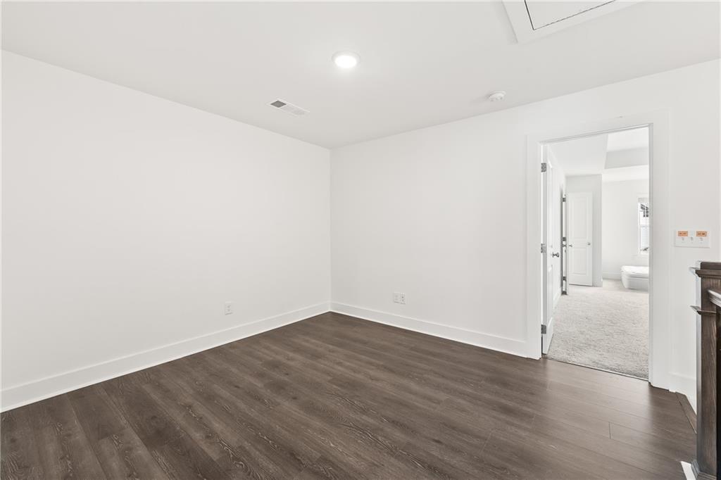 98 Auburn Valley Way Auburn, GA 30011 - Photo 21 of 47 wooden floor in an empty room
