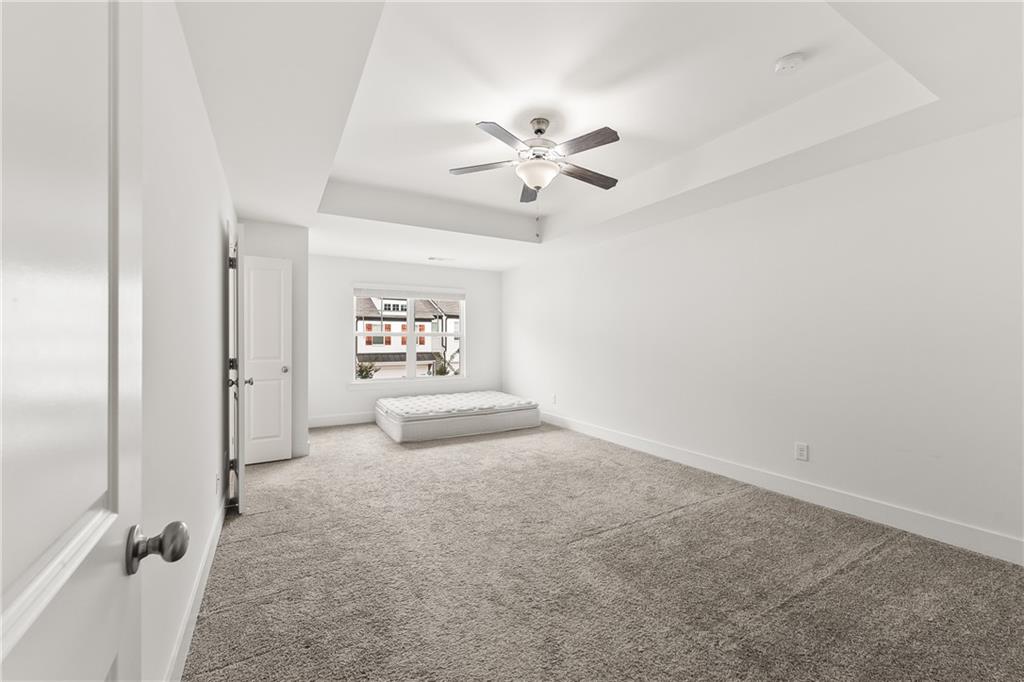 98 Auburn Valley Way Auburn, GA 30011 - Photo 23 of 47 a view of a livingroom with a chandelier fan