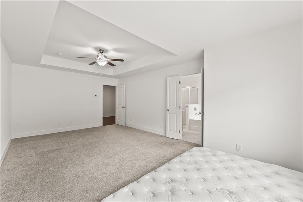 98 Auburn Valley Way Auburn, GA 30011 - Photo 24 of 47 a view of a big room with closet and fan