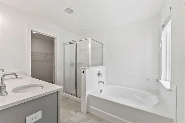 a bathroom with a bathtub and a sink