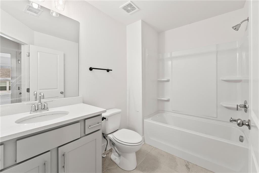 98 Auburn Valley Way Auburn, GA 30011 - Photo 29 of 47 a bathroom with a sink toilet and bathtub