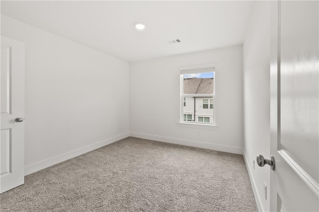 98 Auburn Valley Way Auburn, GA 30011 - Photo 30 of 47 a view of an empty room with a window