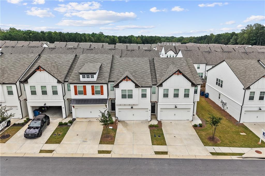98 Auburn Valley Way Auburn, GA 30011 - Photo 40 of 47 an aerial view of multiple houses with a yard