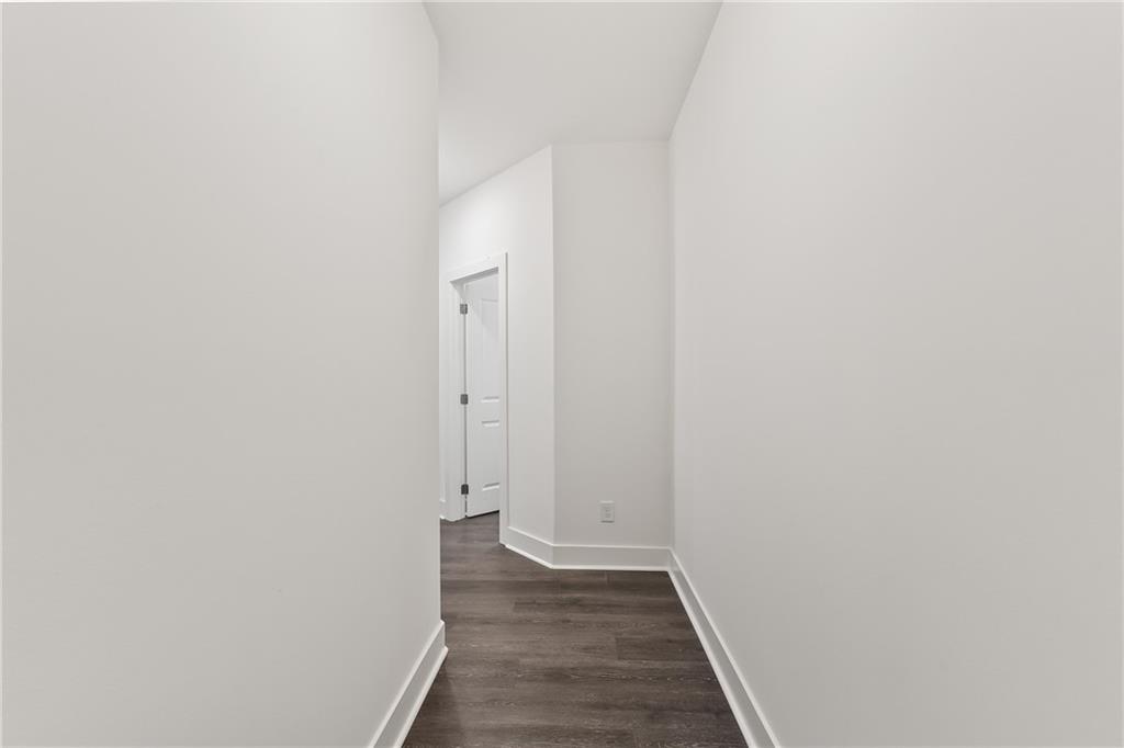 98 Auburn Valley Way Auburn, GA 30011 - Photo 5 of 47 a view of a hallway with wooden floor
