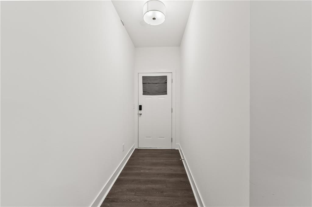 98 Auburn Valley Way Auburn, GA 30011 - Photo 6 of 47 a view of a hallway with wooden floor
