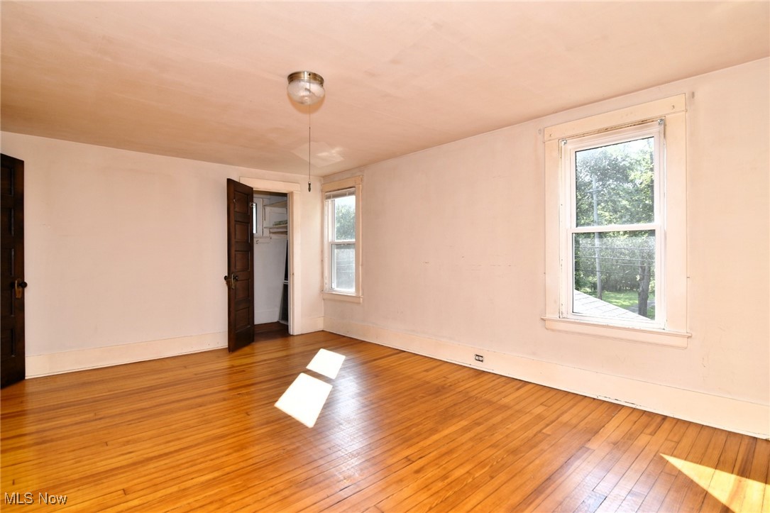 272 Miles Road Chagrin Falls, OH 44022 - Photo 19 of 22 Unfurnished room with plenty of natural light and wood-type flooring
