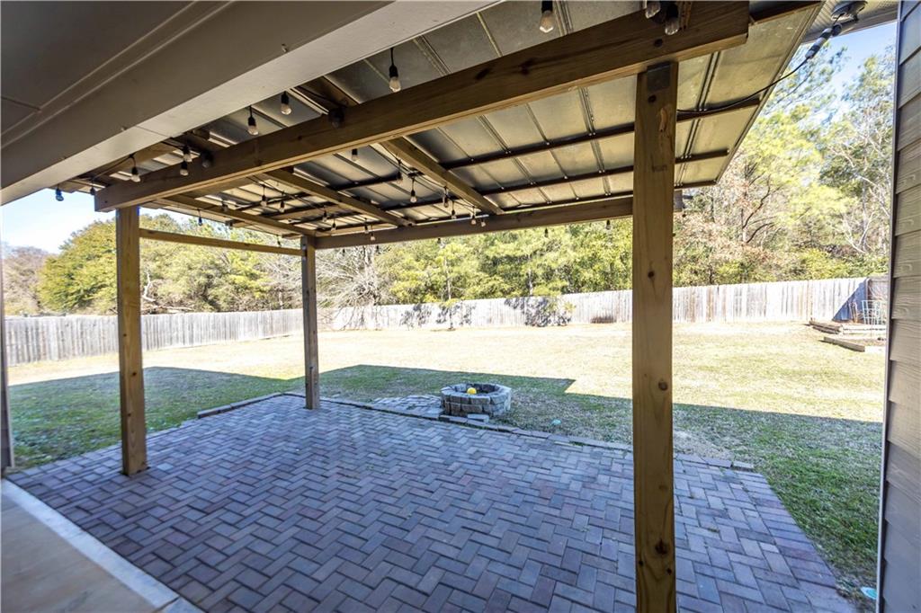 70 Apache Trail Fort Mitchell, AL 36856 - Photo 27 of 33 Fenced backyard with a patio area