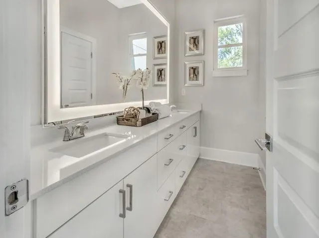 a bathroom with a sink and a mirror
