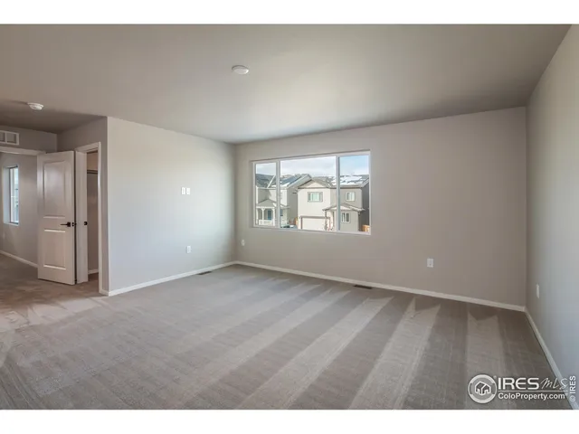 a bathroom with a sink a light fixture and a glass door