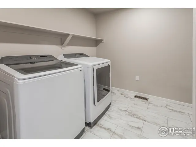 a bathroom with a sink toilet a mirror and shower