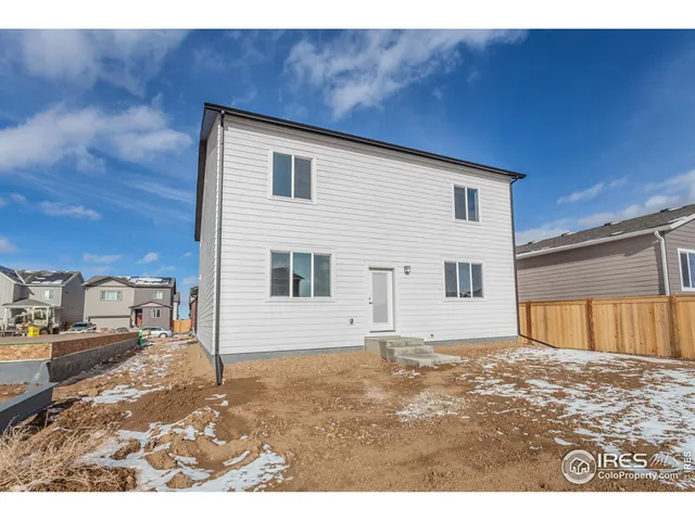 a patio with table and chairs