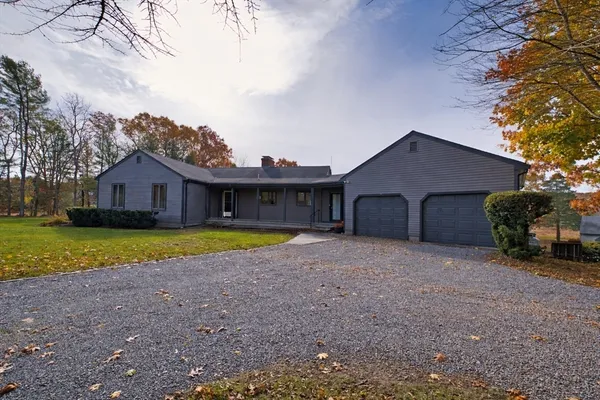 a kitchen with stainless steel appliances granite countertop a refrigerator a sink dishwasher a stove with wooden cabinets and floor