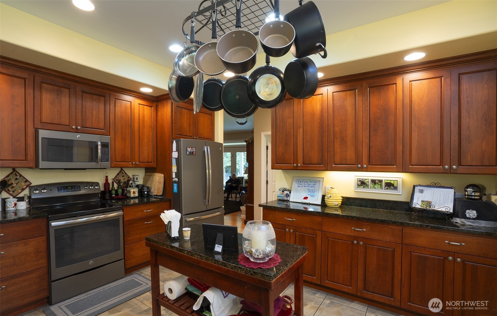 72 Doe Place Sequim, WA 98382 - Photo 12 of 40 a kitchen with wooden cabinets and stainless steel appliances