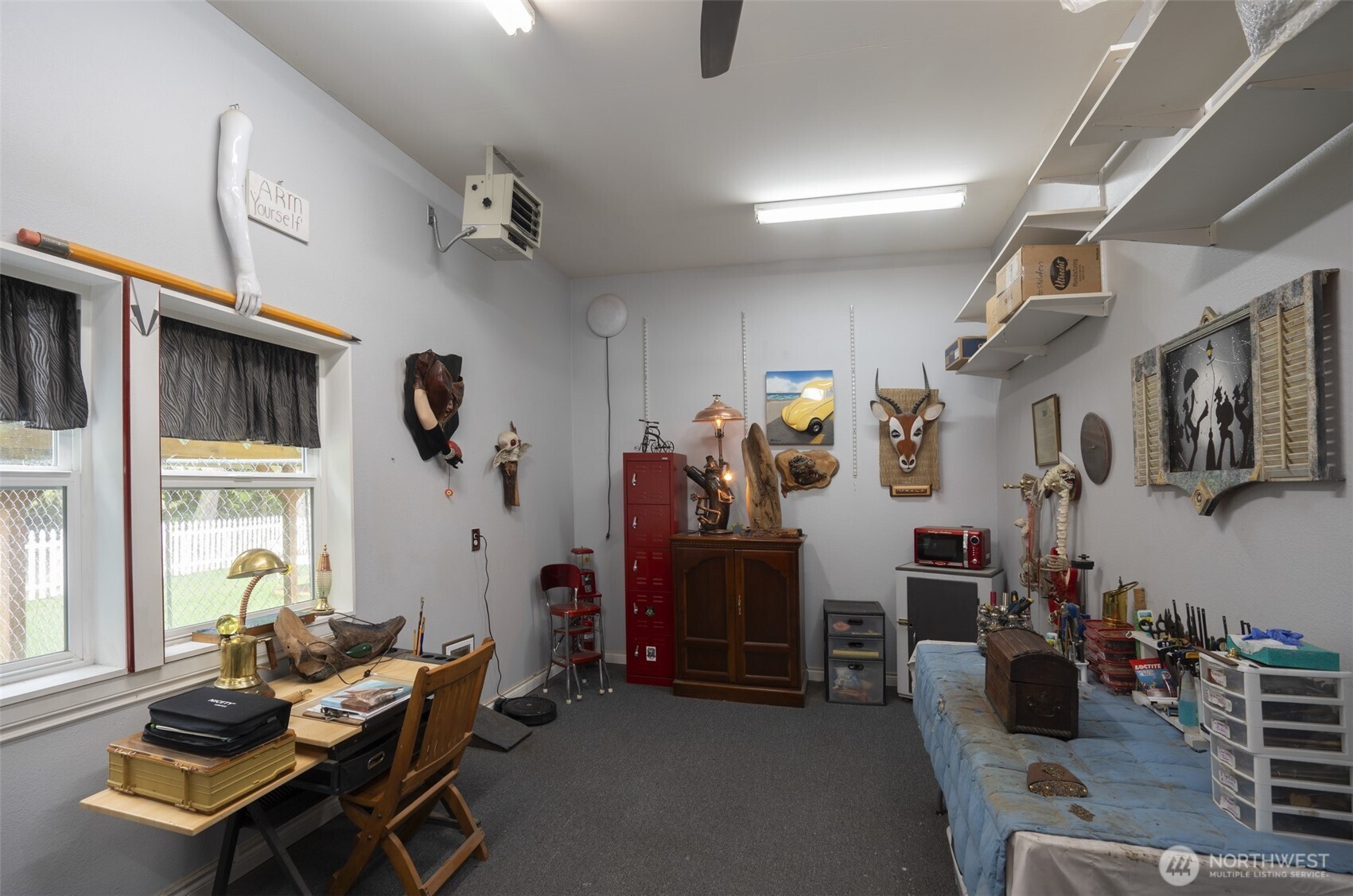 72 Doe Place Sequim, WA 98382 - Photo 24 of 40 a living room with furniture gym equipment and a window
