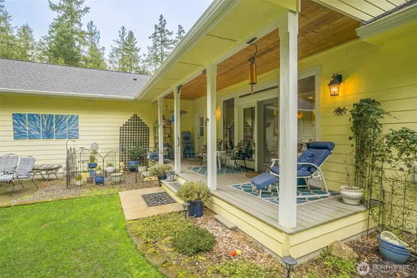 a view of a patio with iron fence