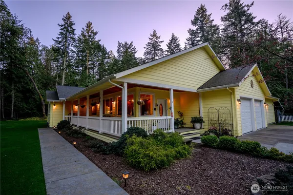a view of house with backyard and garden