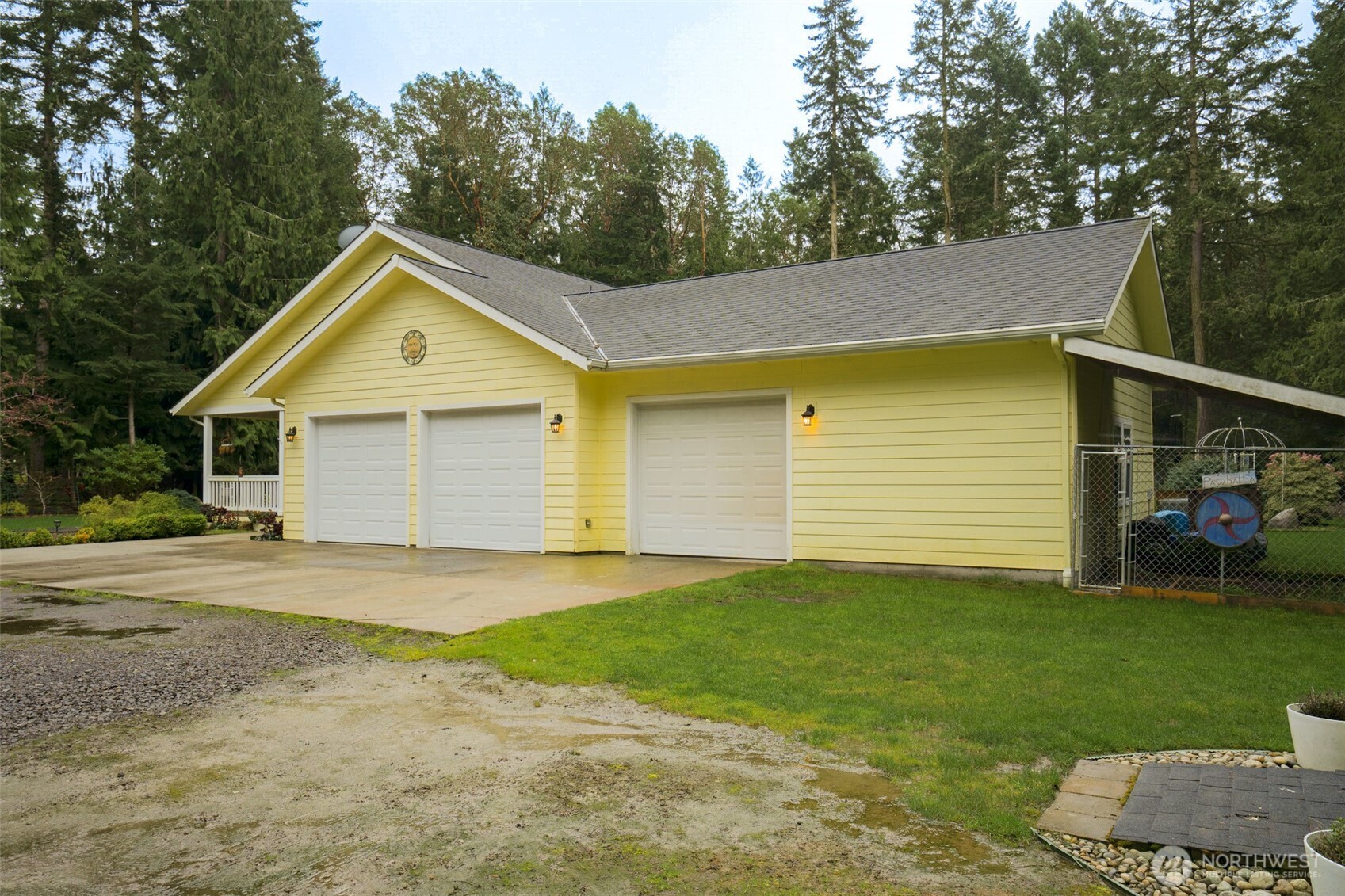 72 Doe Place Sequim, WA 98382 - Photo 39 of 40 a front view of a house with a yard and garage
